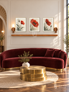 FREMAT Poppy Movement shelf set with three 30 x 40 cm gold frames, 2 cm white borders, honey wood shelf and two warm sensor lamps. Morning Art Deco reception, ivory wall with slim moulding, garnet velvet curved sofa, brass stepped table, walnut parquet, fan-shaped arch left and window right.