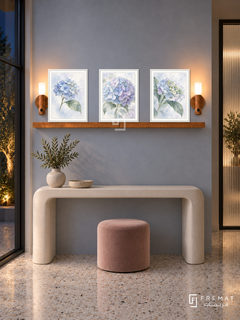 FREMAT Hydrangea Mist shelf set with three 30 x 40 cm white frames, 2 cm white borders, honey wood shelf and two warm sensor lamps. Night pastel foyer, mist blue plaster, ivory console with rounded legs, blush velvet stool, pale terrazzo, dark courtyard window left and ribbed glass doorway right.