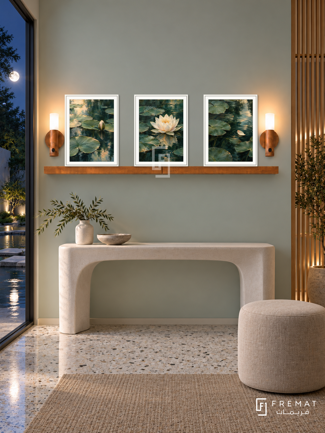 FREMAT Waterlily Reflections shelf set with three 30 x 40 cm white frames, 2 cm white borders, honey wood shelf and two warm sensor lamps. Night tranquil contemporary foyer, pale celadon wall, sculpted white console, linen stool, terrazzo floor, moonlit water garden through glass left, oak screen right.