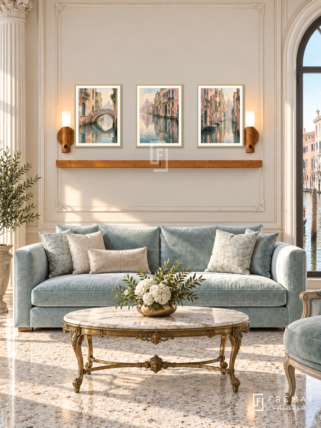 FREMAT Venetian Reflections shelf set with three 30 x 40 cm gold frames, 2 cm white borders, honey wood shelf and two warm sensor lamps. Morning Venetian salon, ivory mouldings, pale aqua velvet sofa, ornate brass oval table, polished terrazzo, arched canal window right, fluted column left.