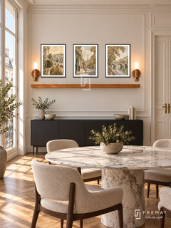 FREMAT Paris In Ochre shelf set with three 30 x 40 cm black frames, 2 cm white borders, honey wood shelf and two warm sensor lamps. Morning Parisian modern dining room, cream wall panels, black sideboard below shelf, round marble table foreground, chevron parquet, tall French window left, double doors right.