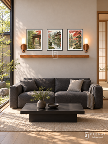 FREMAT Kyoto Stillness shelf set with three 30 x 40 cm black frames, 2 cm white borders, honey wood shelf and two warm sensor lamps. Morning Kyoto contemporary living room, pale clay wall, charcoal low sofa, black lacquer table, pale oak flooring, Japanese courtyard glass left, shoji doorway right.