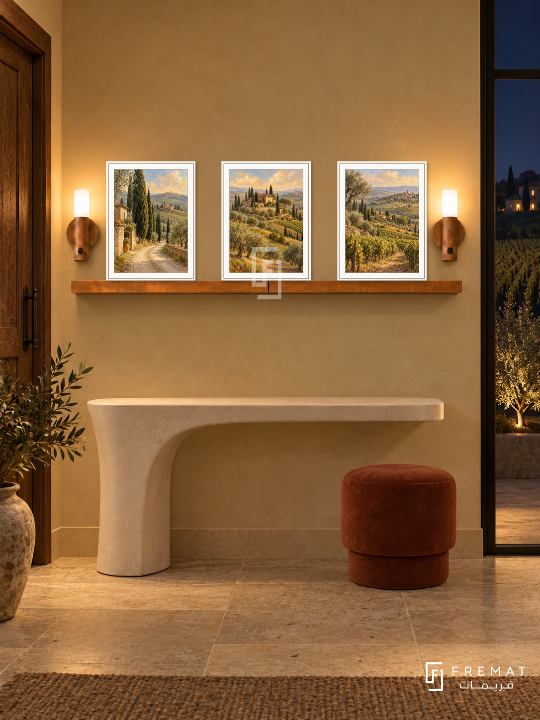 FREMAT Tuscan Afternoon shelf set with three 30 x 40 cm white frames, 2 cm white borders, honey wood shelf and two warm sensor lamps. Night Italian countryside foyer, pale ochre wall, ivory sculpted console, rust stool, limestone floor, dark vineyard glass right, timber door left.