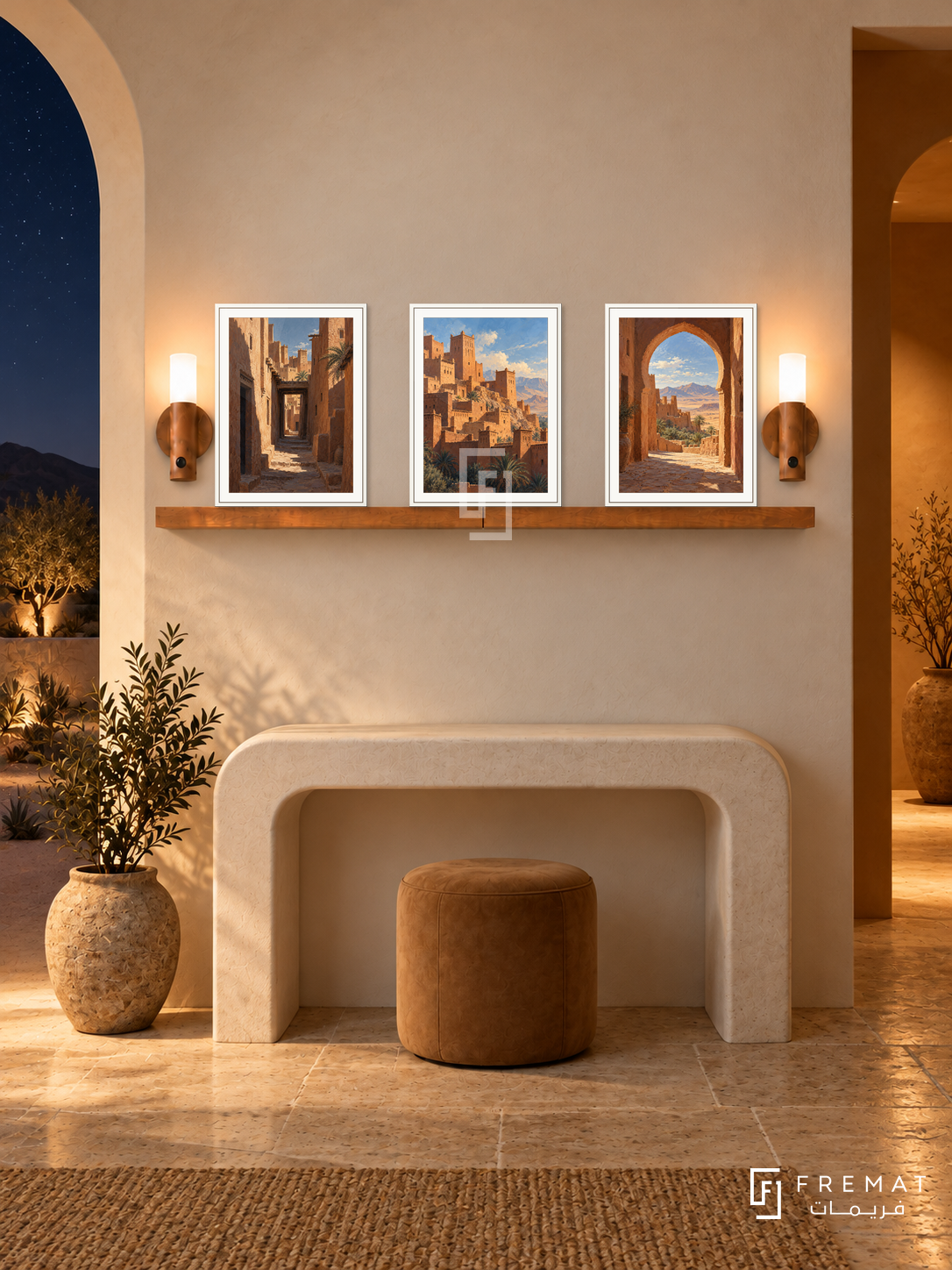 FREMAT Desert Kasbah shelf set with three 30 x 40 cm white frames, 2 cm white borders, honey wood shelf and two warm sensor lamps. Night desert foyer, warm white plaster, ivory arched console, camel stool, stone floor, starry desert through arch left, deep ochre doorway right.