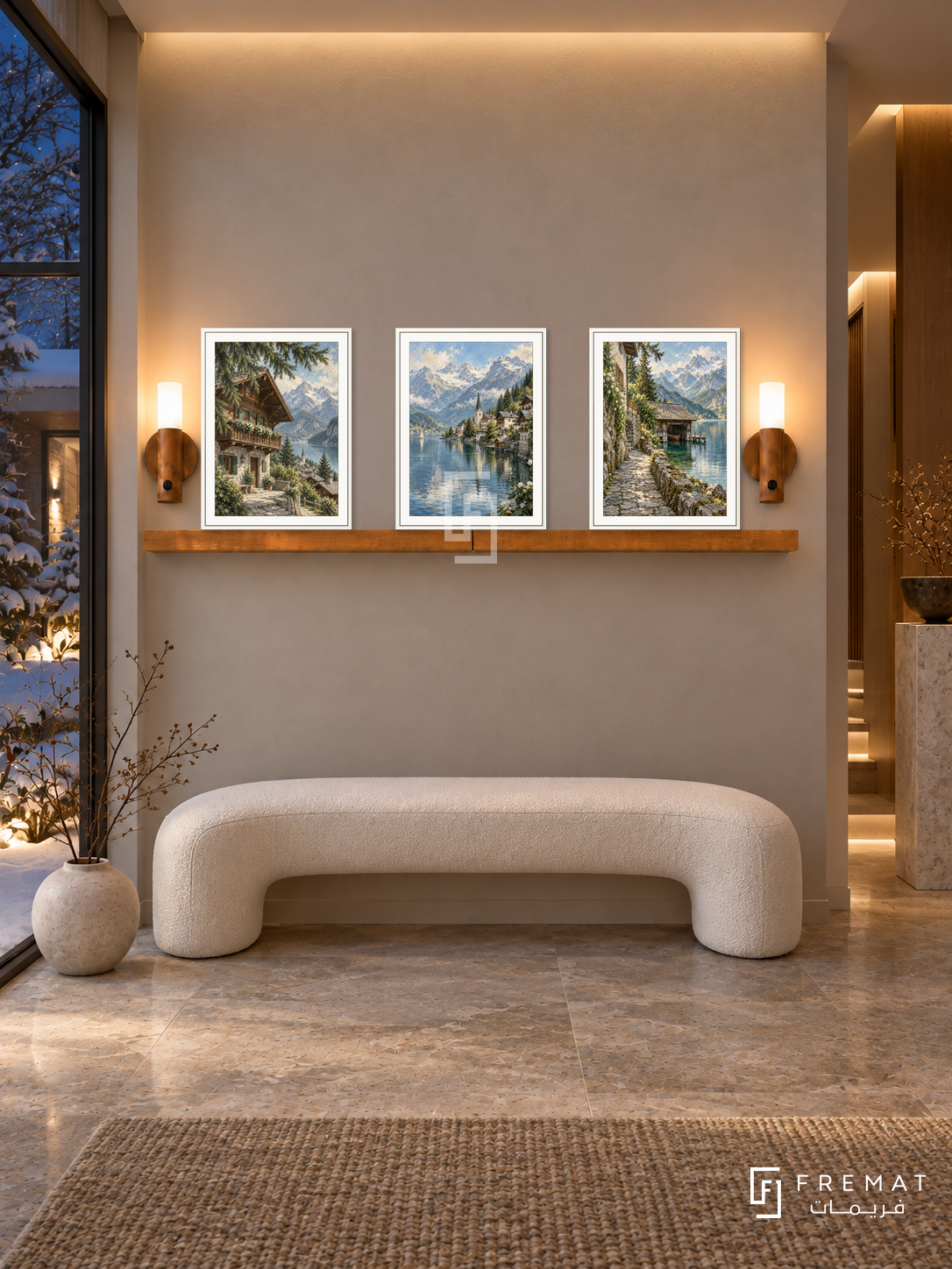 FREMAT Alpine Village shelf set with three 30 x 40 cm white frames, 2 cm white borders, honey wood shelf and two warm sensor lamps. Night alpine entrance, pale taupe wall, white curved bench, limestone pedestal, stone floor, snowy courtyard glass left, warm ceiling recess.
