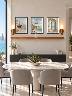FREMAT Kuwait Seaside shelf set with three 30 x 40 cm black frames, 2 cm white borders, honey wood shelf and two warm sensor lamps. Morning Kuwait seaside contemporary dining room, pale stone wall, black floating buffet, oval white marble table, grey chairs, Gulf blue water through side window.