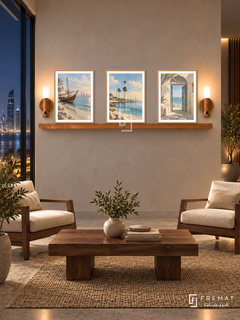FREMAT Kuwait Seaside shelf set with three 30 x 40 cm wooden texture frames, 2 cm white borders, honey wood shelf and two warm sensor lamps. Night Kuwait modern reading lounge, sand plaster, walnut lounge chairs with cream cushions, rectangular timber table, sea skyline behind tall glass.