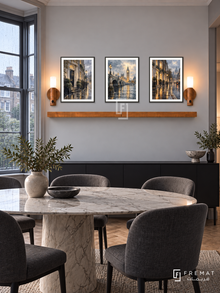 FREMAT London Rain shelf set with three 30 x 40 cm black frames, 2 cm white borders, honey wood shelf and two warm sensor lamps. Morning rainy London modern townhouse dining room, pale grey wall, black sideboard, oval marble table and charcoal upholstered chairs, rain-streaked bay window at side.