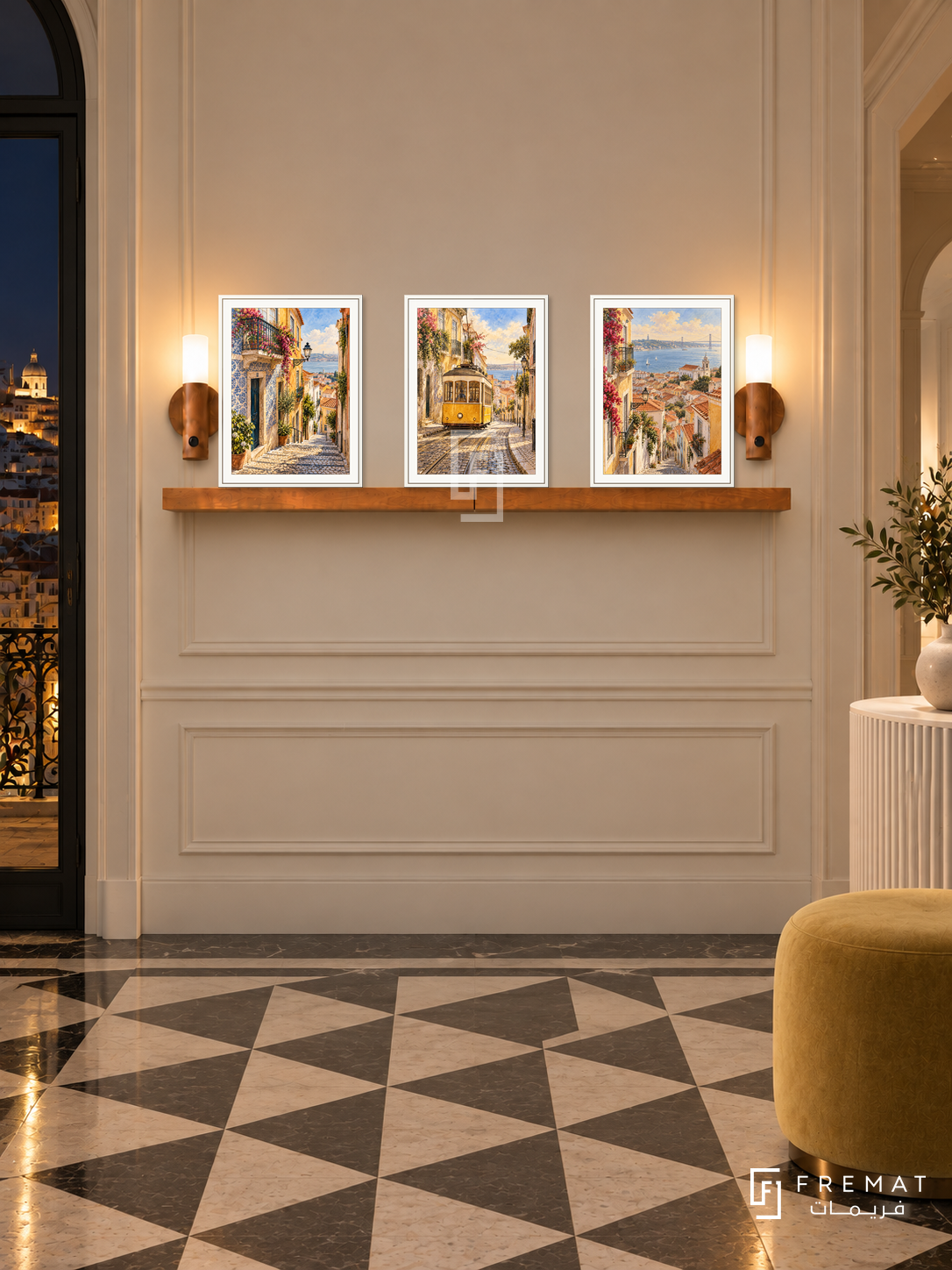FREMAT Lisbon Tramways shelf set with three 30 x 40 cm white frames, 2 cm white borders, honey wood shelf and two warm sensor lamps. Night Lisbon refined foyer, pale cream panels, white fluted console, muted yellow ottoman, geometric tile floor and dark city beyond.