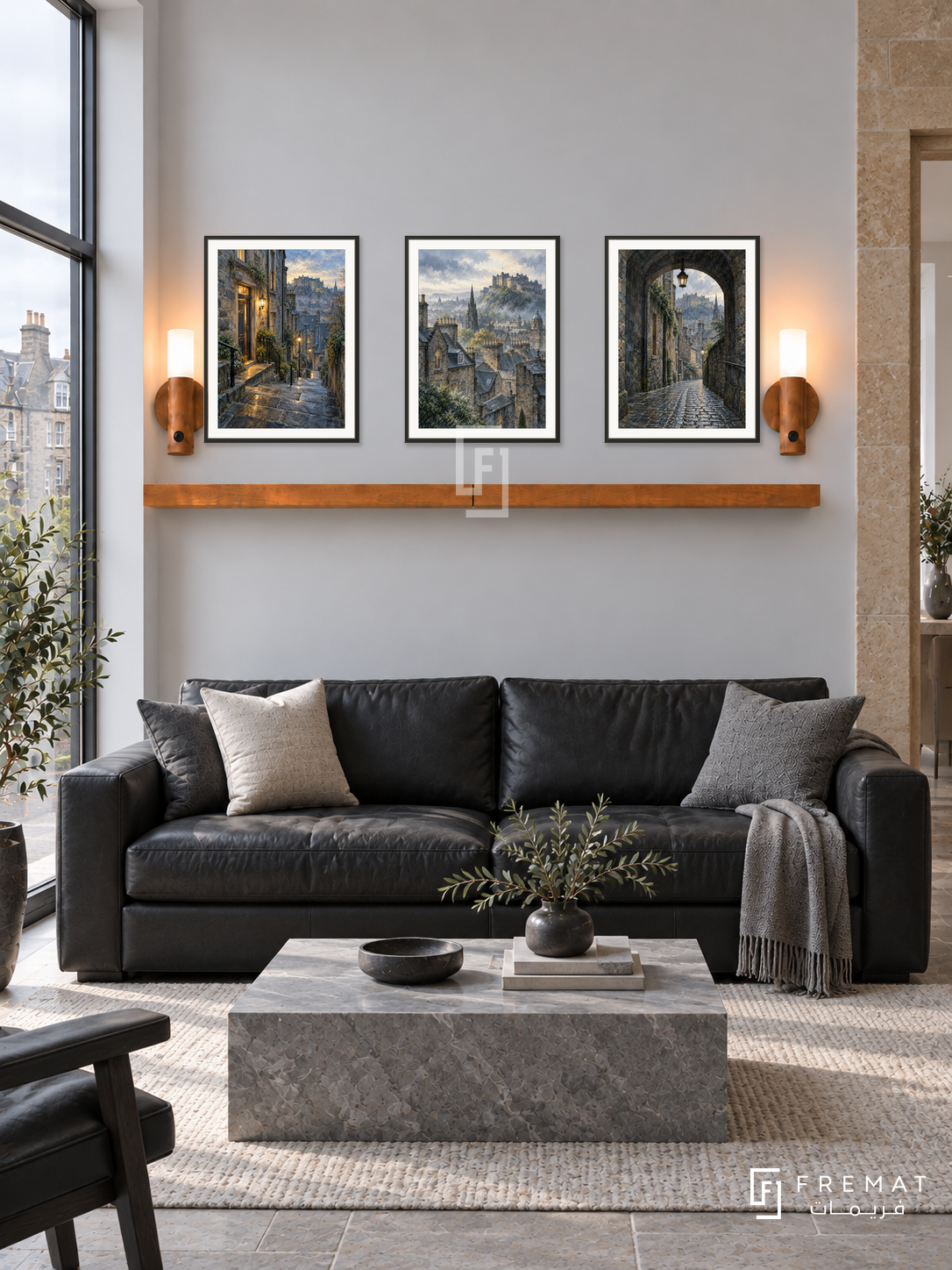 FREMAT Edinburgh Stone shelf set with three 30 x 40 cm black frames, 2 cm white borders, honey wood shelf and two warm sensor lamps. Morning Edinburgh contemporary stone townhouse, smooth pale grey wall with sandstone side doorway, black leather sofa, grey stone table, soft overcast window light.