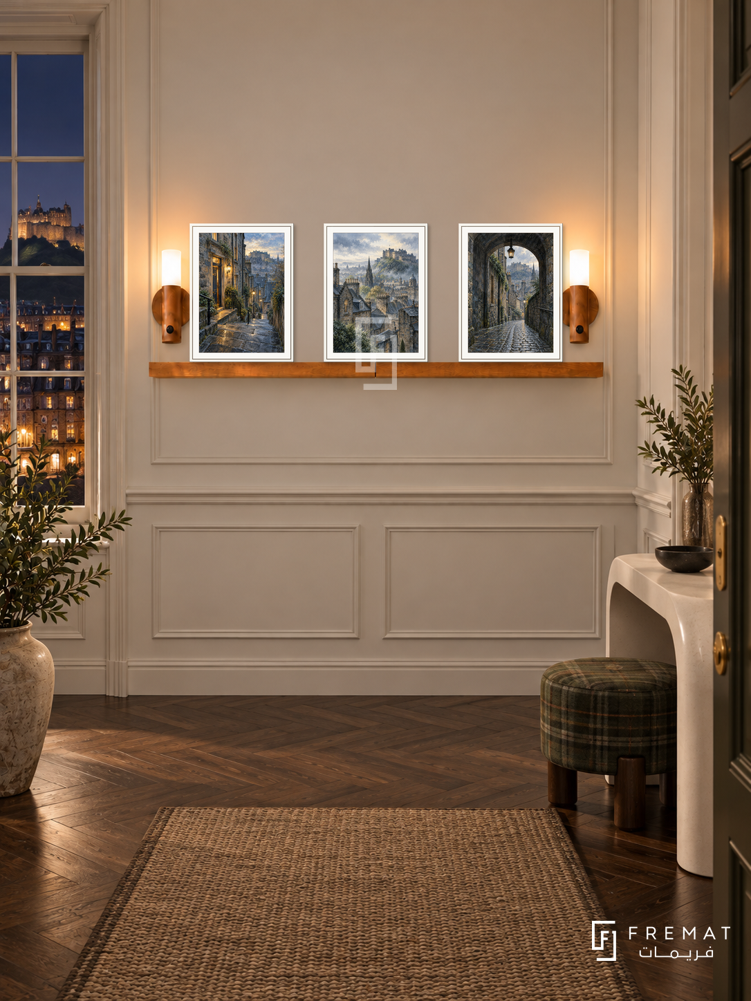 FREMAT Edinburgh Stone shelf set with three 30 x 40 cm white frames, 2 cm white borders, honey wood shelf and two warm sensor lamps. Night Edinburgh entrance hall, cream paneling, white curved console, tartan muted green stool, dark parquet and city lights through sash window.