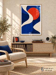 Cobalt Current: An ivory ribbon winds through cobalt and deep navy fields beside a vivid vermilion disc. Wooden Texture PVC frame displayed with a record console and woven lounge chair.