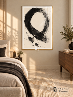 Monochrome Gesture: A sweeping black brushstroke forms an open loop on warm ivory, with dry-brush marks and scattered ink-like splashes. Gold PVC frame displayed with a neutral bed and walnut dresser.