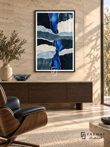 Blue Strata: Ragged, paper-like layers in navy, cobalt, slate blue and ivory cross vertically and horizontally, edged with narrow gold-colored seams. Black PVC frame displayed with a walnut sideboard and leather lounge chair.