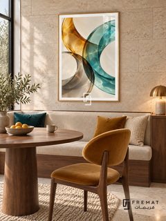 Amber Refraction: Translucent amber, teal and smoky gray ribbons curve across ivory, overlapping with luminous glass-like highlights and rippling light patterns. Gold PVC frame displayed with a walnut dining table with cream banquette and mustard chair.