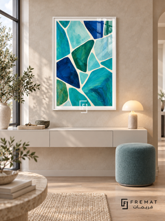 Lagoon Mosaic: Irregular turquoise, aqua, cobalt and deep green shapes form a painterly mosaic separated by flowing ivory channels. White PVC frame displayed with a floating cream console and blue upholstered stool.
