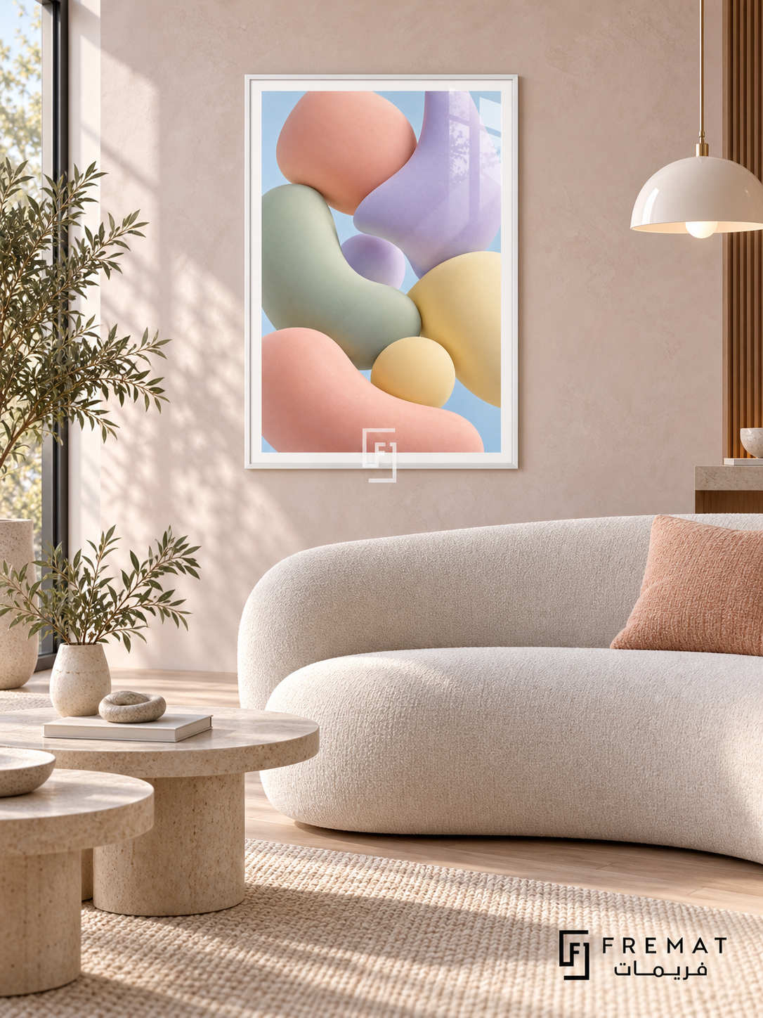 Pastel Drift: Softly shaded pebble-like forms in peach, sage, lilac and pale yellow float together against a light blue background. White PVC frame displayed with a curved cream sofa and stone nesting tables.