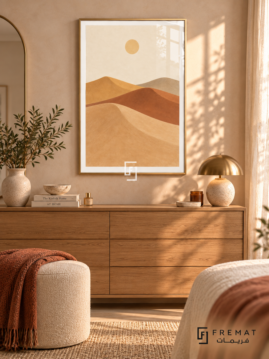 Desert Dunes. Sweeping layers of sand, clay, ochre and taupe dunes sit beneath a small pale sun. Shown in a Gold PVC frame in a styled room.