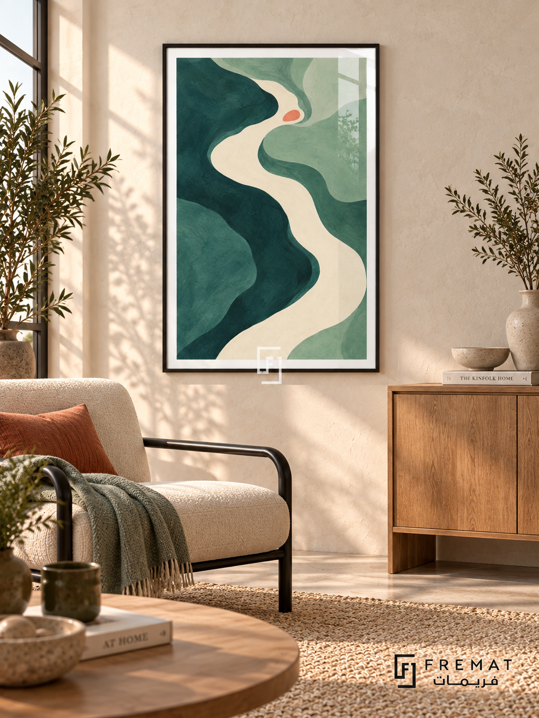 Teal River. Flowing teal and sage shapes surround an ivory river-like curve with a small coral accent. Shown in a Black PVC frame in a styled room.