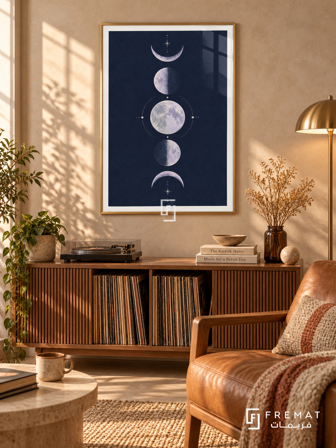 Indigo Moons. Five lavender moon phases form a vertical column among delicate cream stars on a navy background. Shown in a Gold PVC frame in a styled room.