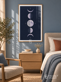 Indigo Moons. Five lavender moon phases form a vertical column among delicate cream stars on a navy background. Shown in a Wooden Texture PVC frame in a styled room.