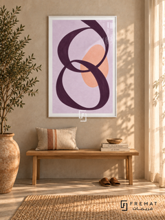Lilac Loops. A looping plum ribbon crosses a peach oval on a lavender background. Shown in a White PVC frame in a styled room.