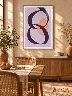 Lilac Loops. A looping plum ribbon crosses a peach oval on a lavender background. Shown in a Wooden Texture PVC frame in a styled room.