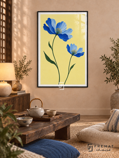 Blue Wildflowers. Two blue flowers on green stems brighten a buttery yellow background. Shown in a Black PVC frame in a styled room.