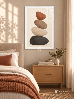Balanced Stones. Four charcoal, ivory, taupe and terracotta stones form a quiet vertical stack. Shown in a White PVC frame in a styled room.
