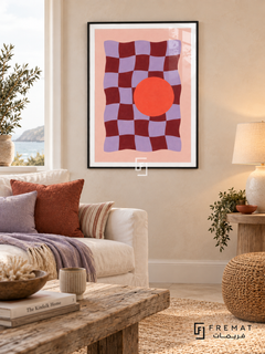 Playful Checker. A wavy burgundy and lavender checkerboard meets a bold coral-orange circle on pink. Shown in a Black PVC frame in a styled room.