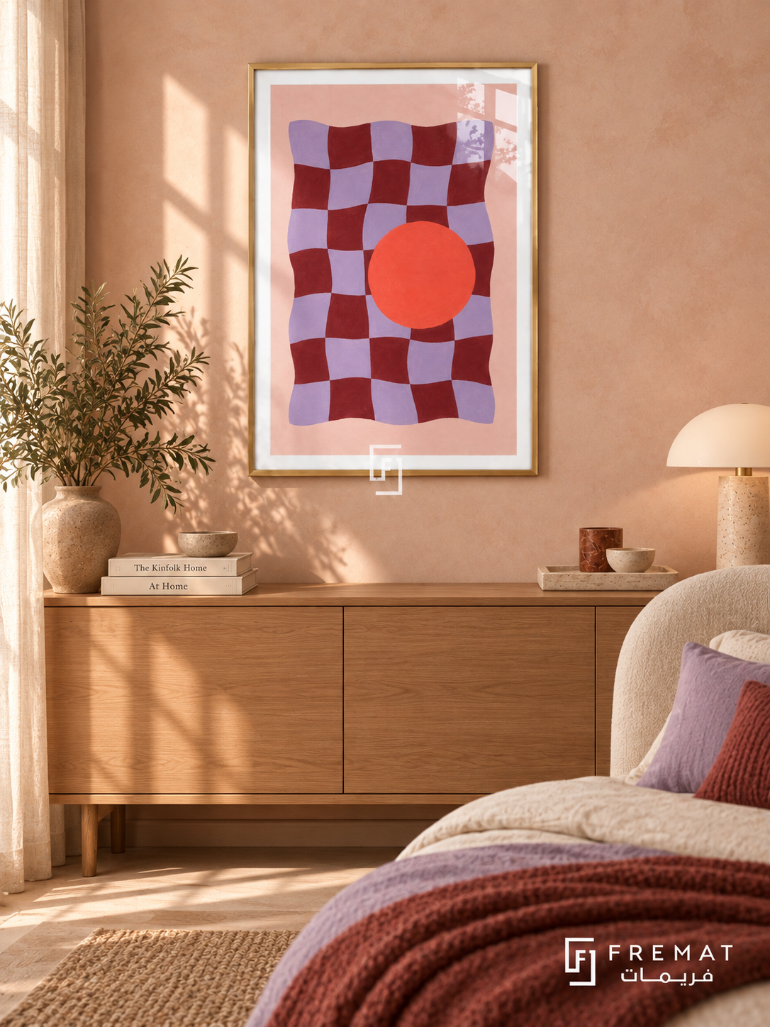 Playful Checker. A wavy burgundy and lavender checkerboard meets a bold coral-orange circle on pink. Shown in a Gold PVC frame in a styled room.