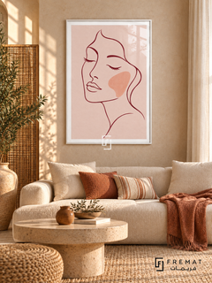 Blush Portrait. A burgundy line drawing of a face with closed eyes and a peach cheek rests on blush pink. Shown in a White PVC frame in a styled room.