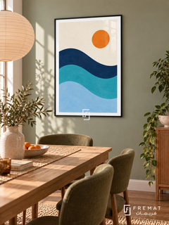 Blue Tide. Three flowing navy, turquoise and pale blue wave bands sit below an orange sun in an ivory sky. Shown in a Black PVC frame in a styled room.