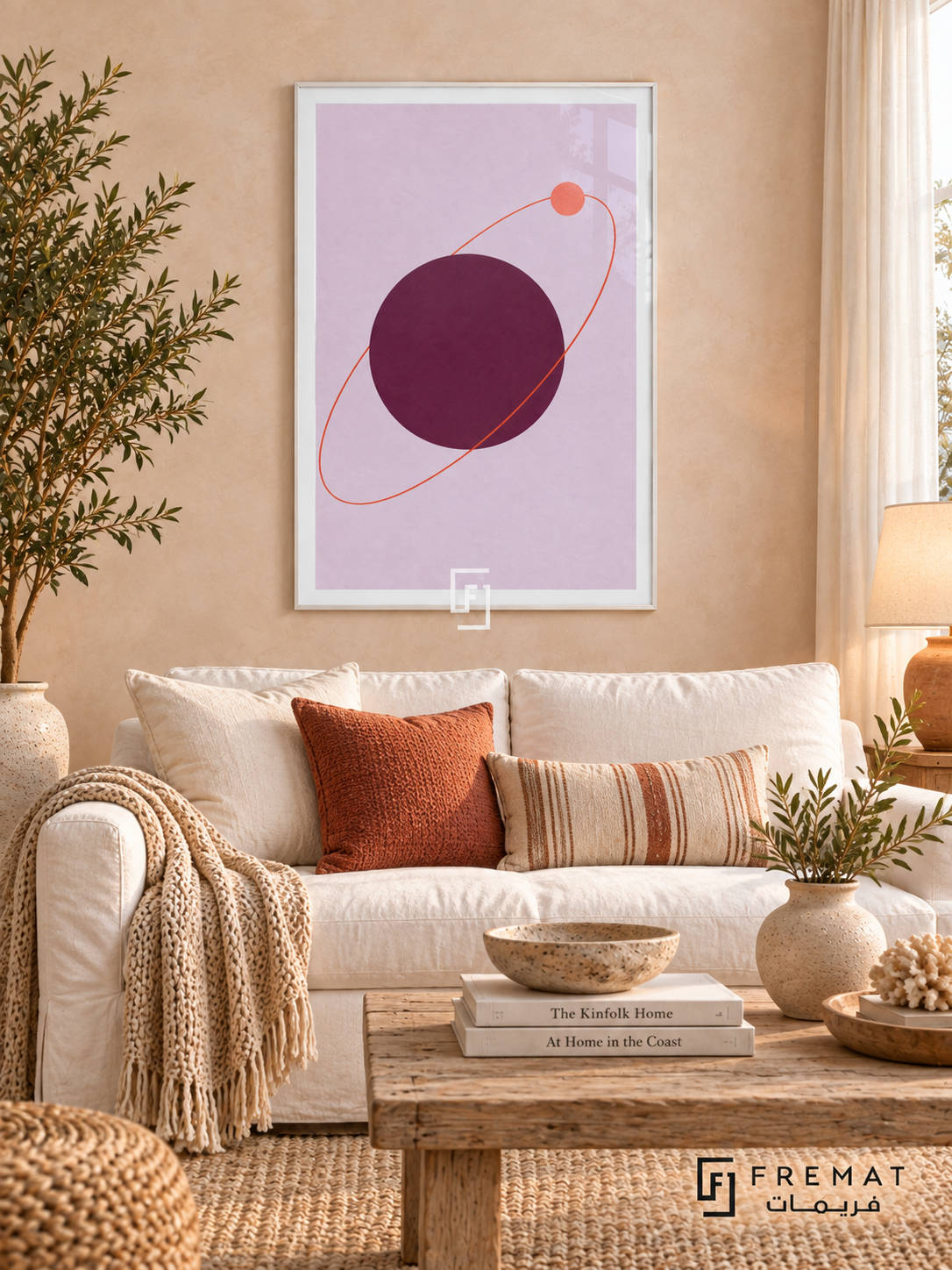 Plum Orbit. A coral orbit and small disk circle a large plum sphere on lavender. Shown in a White PVC frame in a styled room.