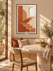Quiet Stair. Terracotta stairs ascend through soft beige arches toward a pale opening. Shown in a Black PVC frame in a styled room.