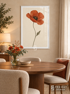 Single Poppy. A single terracotta-red poppy blooms above a slender olive-green stem and leaf on ivory. Shown in a White PVC frame in a styled room.