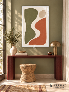 Cut Paper Dialogue. Olive-green and terracotta organic shapes face one another across an ivory curve beneath a sand-colored oval. Shown in a White PVC frame in a styled room.