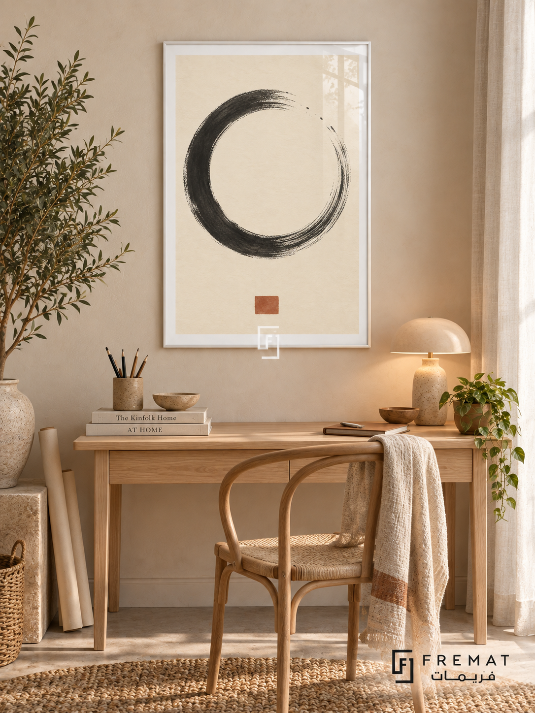 Ink Stillness. A charcoal dry-brush circle and small terracotta square create a spare composition on warm ivory. Shown in a White PVC frame in a styled room.