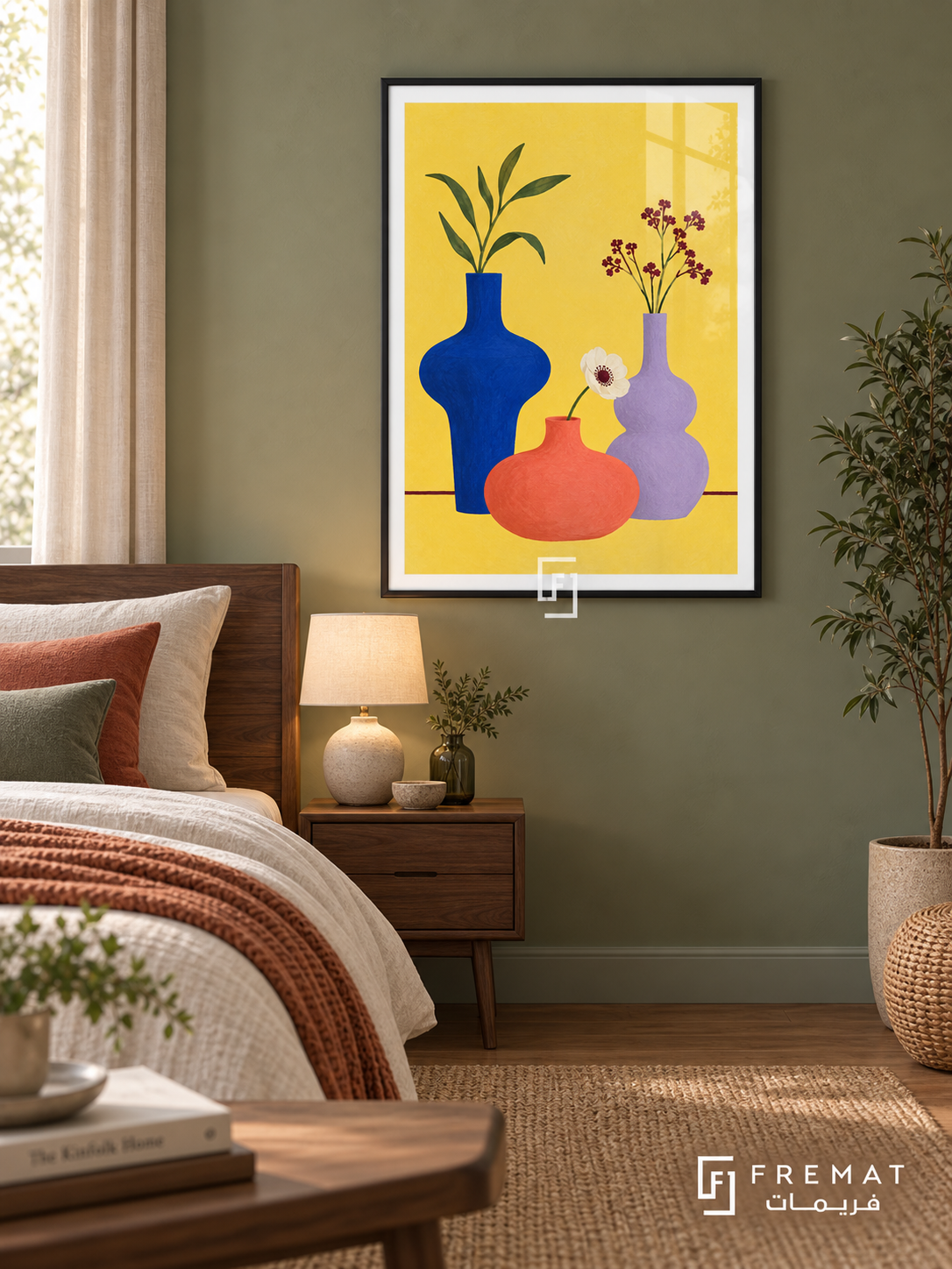 Colorful Still Life. Cobalt, coral and lavender vases hold leaves and flowers against yellow above a burgundy table line. Shown in a Black PVC frame in a styled room.