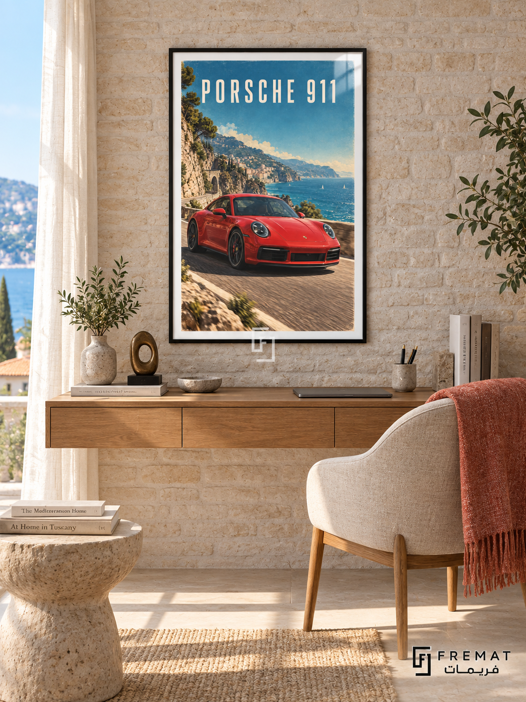 Porsche 911 Coast (car14), Black frame with white printed border in a styled interior. A red Porsche 911 follows a coastal road beside blue water, hillside buildings and greenery. Cream PORSCHE 911 lettering sits against the bright blue sky.