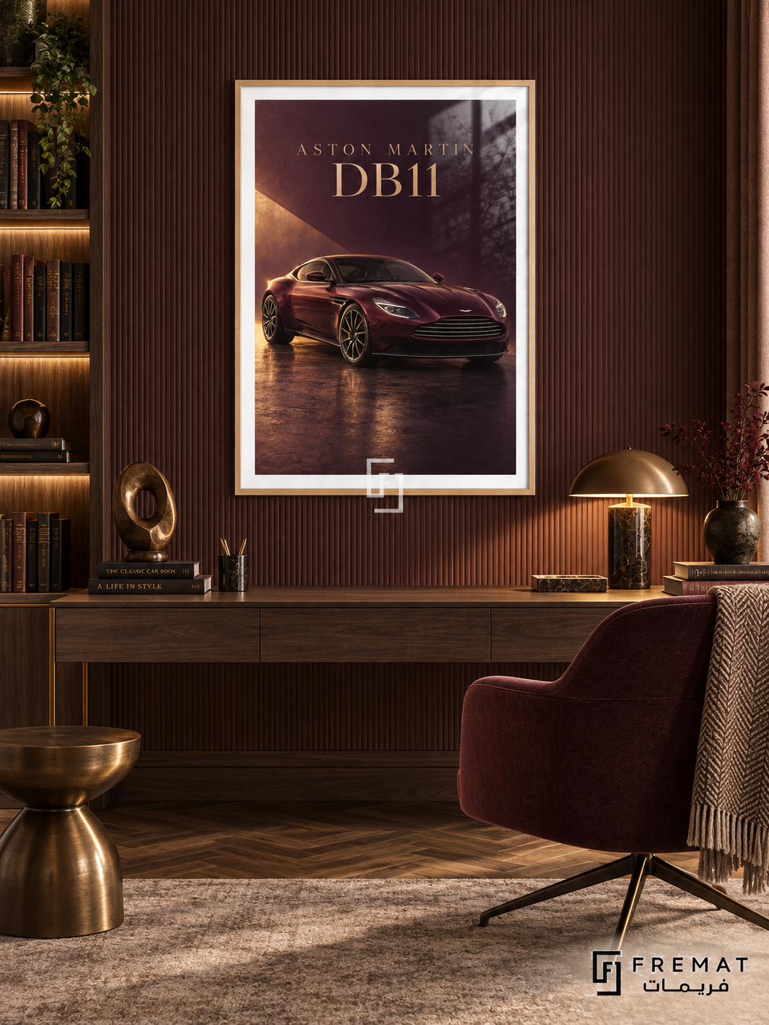 Aston Martin DB11 (car19), Wooden Texture frame with white printed border in a styled interior. A burgundy Aston Martin DB11 sits on a glossy dark floor under a warm diagonal shaft of light. Gold-toned ASTON MARTIN DB11 lettering completes the wine-red composition.