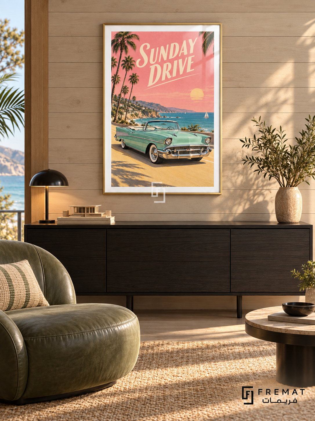 Sunday Drive (car22), Gold frame with white printed border in a styled interior. A mint-green vintage convertible stands on a sunny coastal road beneath palm trees and a pink sunset sky. Cream slanted lettering reads SUNDAY DRIVE.