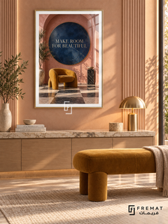 Make Room for Beautiful (com18), Gold frame with white printed border in a styled interior. A mustard sculptural chair sits beneath a navy circle inside a terracotta arch, with a checkerboard floor and leafy shadows. Small gold lettering reads “MAKE ROOM FOR BEAUTIFUL”.