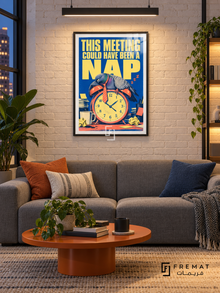 Meeting Nap (fun01) — Black frame, white paper border and FREMAT branding in a styled interior. A sleeping pigeon slumps over an orange alarm clock among papers and mugs. Oversized yellow lettering on blue reads “THIS MEETING COULD HAVE BEEN A NAP,” with a distressed retro print texture.