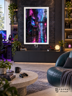 Arcade After Dark gaming artwork in a White PVC frame with a white printed border, displayed in a bright gaming room with dark cabinetry and a teal chair.