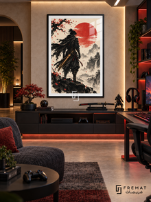 Ink Samurai gaming artwork in a Black PVC frame with a white printed border, displayed in a warm gaming lounge with dark console and red accent lighting.