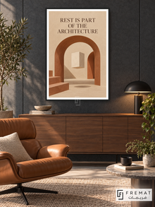 Architecture of Rest (quo06), English quote artwork in a slim matte black PVC frame with a white printed border. Quiet work lounge.