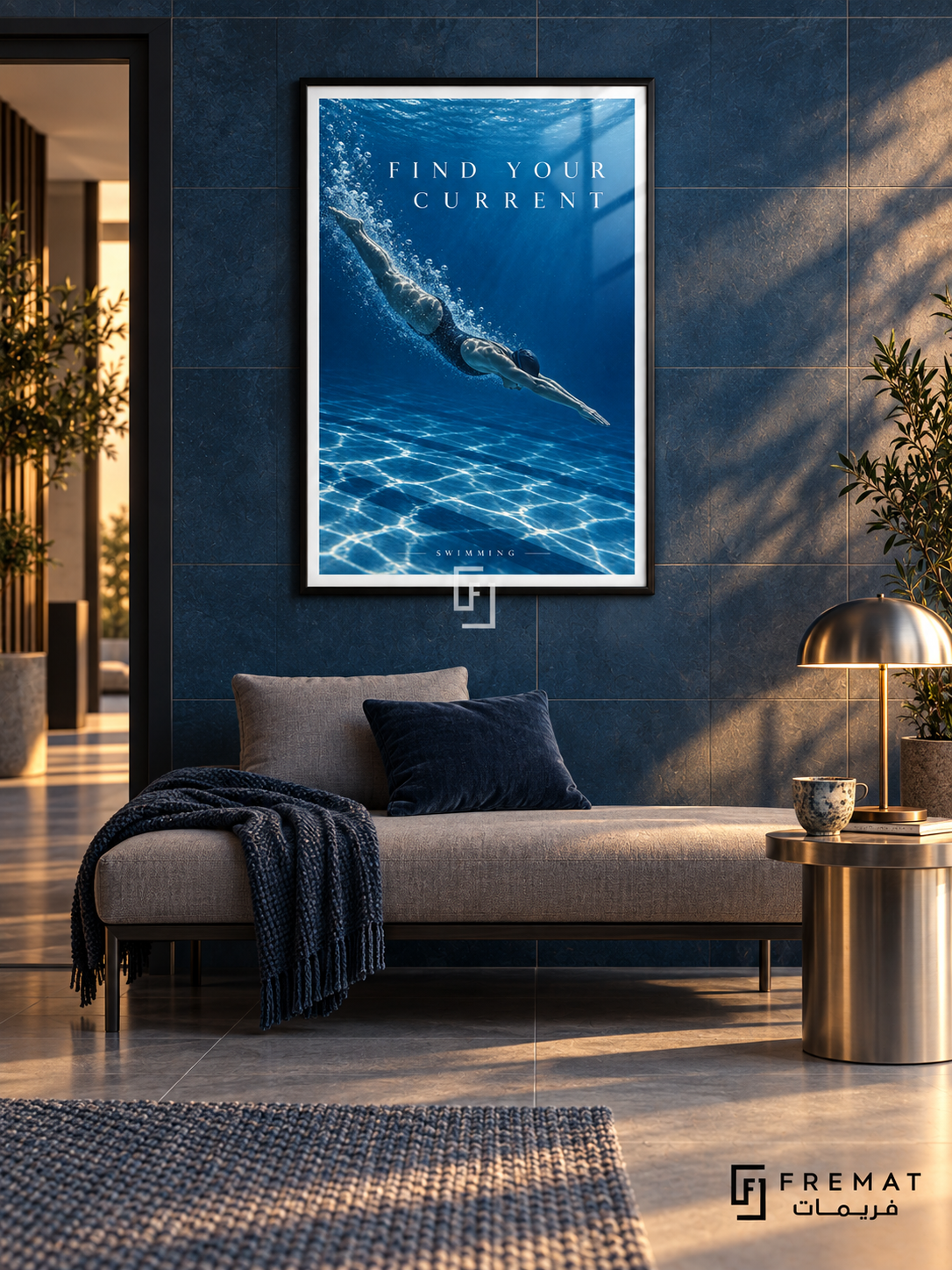 Find Your Current: A swimmer glides through deep cobalt water with a trail of bubbles and shimmering silver light. Black frame with a white printed border, displayed in a styled room.