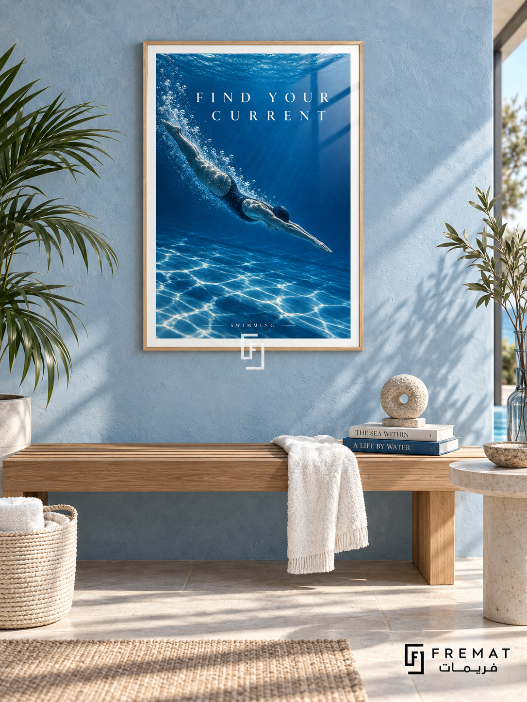 Find Your Current: A swimmer glides through deep cobalt water with a trail of bubbles and shimmering silver light. Wooden Texture frame with a white printed border, displayed in a styled room.