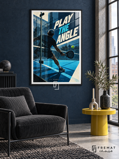 Play The Angle: A padel player and perforated racket appear among blue court geometry, glass reflections and a bright yellow ball. Black frame with a white printed border, displayed in a styled room.